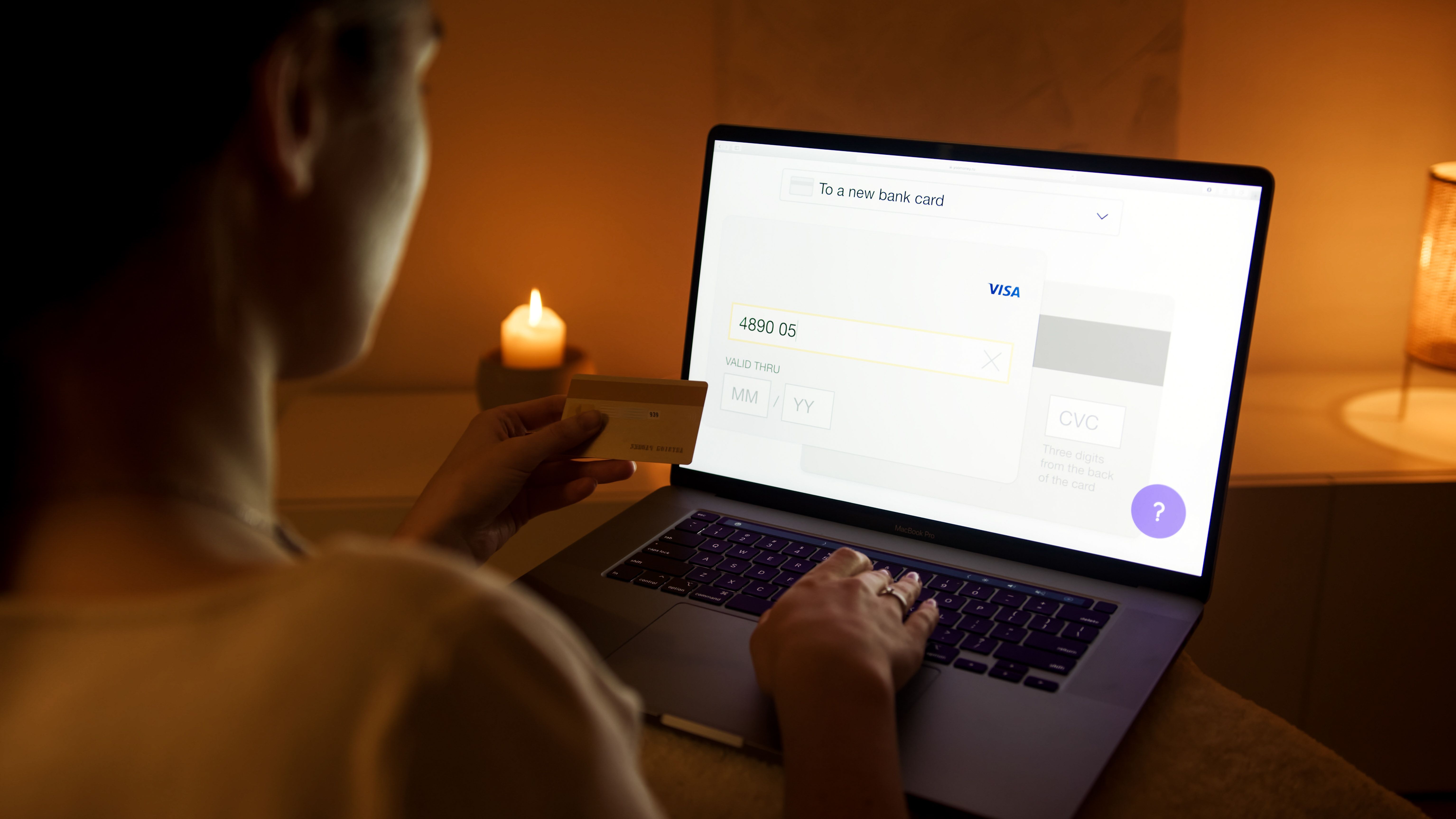 Woman making a secure online payment with a laptop and credit card